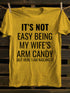 Unisex It's Not Easy Being My Wife's Arm Candy T-shirt