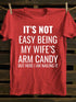 Unisex It's Not Easy Being My Wife's Arm Candy T-shirt